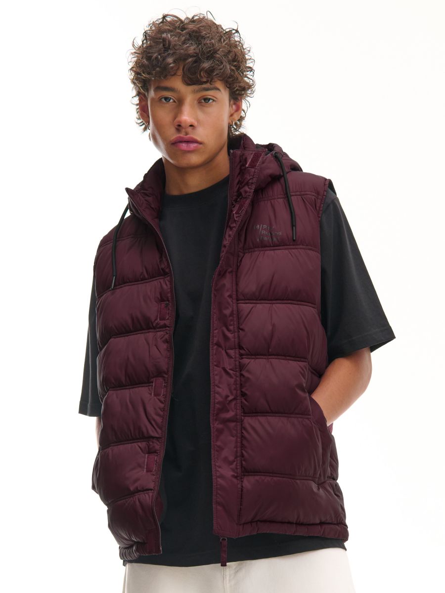 Quilted vest with a hood