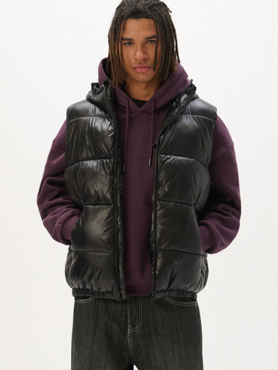 Quilted vest with a hood