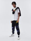 Joggery z nadrukiem all over - czarny - CROPP - small1